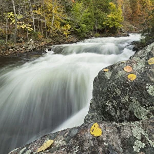 Long Exposure Of Water Flowing Down Kawagama Falls In The Autumn, Near Dorset; Ontario, Canada
