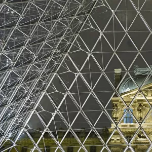 Looking Out Of The Pyramid To The Louvre Museum At Night, Paris, France