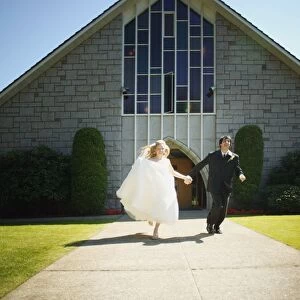 Newlyweds Run Together From Chapel