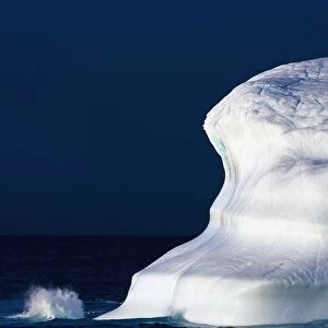 Ocean Water Splashing Against An Iceberg In The High Arctic Waters; Nunavut, Canada