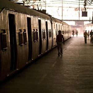 Passengers And Trains In A Train Station; Mumbai, India