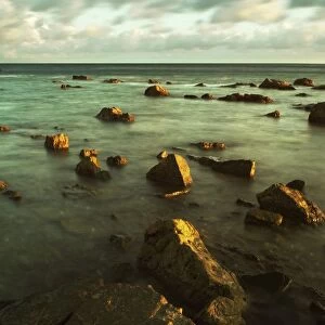 Rocks In Shallow Water By The Shore