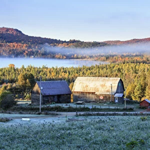 Rustic Buildings And Barn Among Autumn Colors At Sunrise; Blanche, Outaouais, Quebec, Canada