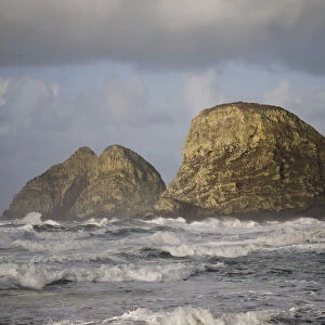Waves Break Near Three Arch Rocks; Oceanside, Oregon, United States Of America