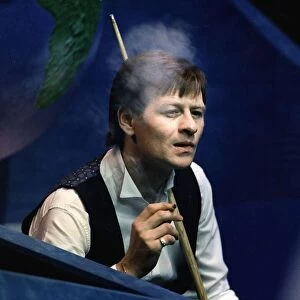 Alex Higgins snooker player alias Hurricane Higgins smoking cigarette during a match 1988