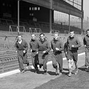 Arsenal Football Club April 1950 Arsenal players train in front of the main east