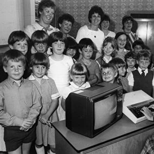 Children using computers. Pupils at Cramlingtons Crawhall First School were given
