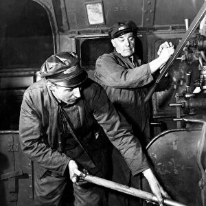 Engine driver and fireman at work on a British Railways locomotive, February 1954