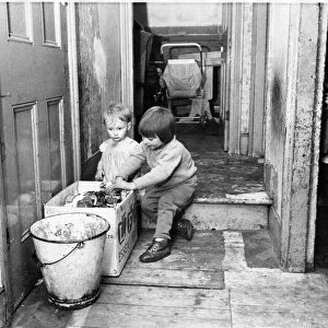 The Interior of slum housing in an area of Newcastle - Children finding anythig to play