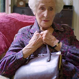 Old Lady holding her handbag Old Lady Sitting in A Chair