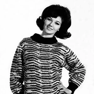 Reveille Fashions: Meriel Weston wearing striped jumper. October 1964 P006756