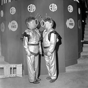 Schoolboys wearing space suits to board the Space Machine at a school exhibition