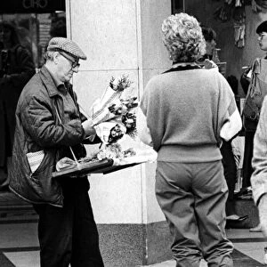 A street trader selling flowers on Northumberland Street, Newcastle on 19th October 1984