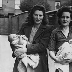 Three weeks old Raymond Ratford, the youngest evacuee, photographed with the mother
