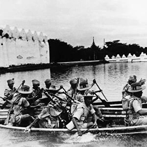 WW2 Indian troops training for river crossing on the moat of Mandalays famous old fort
