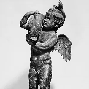 Cupid with Dolphin; small statue coming from Pompeii kept in the National Archaeological Museum in Naples
