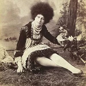 Portrait of a seated woman with afro hair