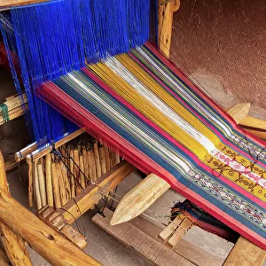 Peru, Sacred valley, detail of looming machine processing alpaca wool