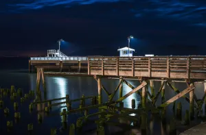 17th Street Pier Is Illuminated On A Summer Evening; Astoria, Oregon, United States 17th Street Pier Is Illuminated On A Summer Evening; Astoria, Oregon, United States