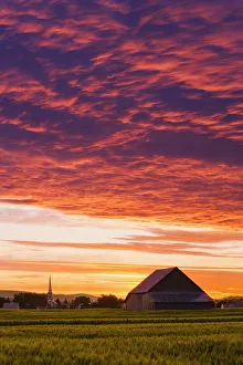 Barley Fields, Barn, Church And Colourful Sky At Dusk, Bas-Saint-Laurent Region Barley Fields, Barn, Church And Colourful Sky At Dusk, Bas-Saint-Laurent Region