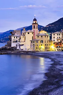 Buildings Illuminated By Lights Along The Waters Edge At Sunrise; Camogli, Liguria Buildings Illuminated By Lights Along The Waters Edge At Sunrise; Camogli, Liguria
