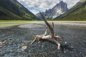 A Clear Stream Flows Into Glacier Lake In Front Of Mount Harrison Smith; Northwest Territories, Canada A Clear Stream Flows Into Glacier Lake In Front Of Mount Harrison Smith; Northwest Territories, Canada