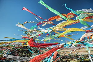 Colourful Tibetan Prayer Flags (Lung Ta) Under The Strong Wind With White Mountain Colourful Tibetan Prayer Flags (Lung Ta) Under The Strong Wind With White Mountain