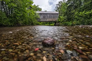 Covered bridge over a stream Covered bridge over a stream