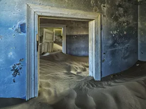 Drifting Sand Fills The Rooms Of A Colourful Abandoned House; Kolmanskop, Namibia Drifting Sand Fills The Rooms Of A Colourful Abandoned House; Kolmanskop, Namibia