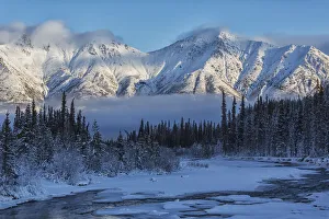 Grey Ridge Looms Over The Wheaton River Near Whitehorse; Yukon, Canada Grey Ridge Looms Over The Wheaton River Near Whitehorse; Yukon, Canada