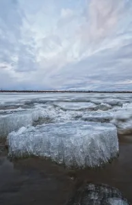 Long Exposure Of The Ice Flowing Down The Porcupine River After It Broke Up; Old Crow, Yukon, Canada Long Exposure Of The Ice Flowing Down The Porcupine River After It Broke Up; Old Crow, Yukon, Canada