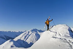 Man Climbing A Snow Ridge For Back Country Skiing, Turnagain Pass, Kenai Mountains Man Climbing A Snow Ridge For Back Country Skiing, Turnagain Pass, Kenai Mountains
