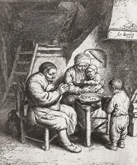 A poor peasant family say grace before starting their meal from a communal plate A poor peasant family say grace before starting their meal from a communal plate