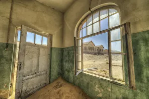 Sand In The Rooms Of A Colourful And Abandoned House; Kolmanskop, Namibia Sand In The Rooms Of A Colourful And Abandoned House; Kolmanskop, Namibia
