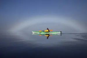 A Sea Kayaker Paddles Along The Edge Of A Thick Fog Bank In Southeast Alaskas Stephens A Sea Kayaker Paddles Along The Edge Of A Thick Fog Bank In Southeast Alaskas Stephens
