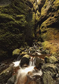 A Stream Runs Through A Slot Canyon Along The Southern Coastline Of The Snaefellsnes Peninsula; Iceland A Stream Runs Through A Slot Canyon Along The Southern Coastline Of The Snaefellsnes Peninsula; Iceland