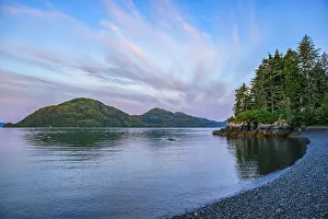 Sunset light on the clouds over the islands of Prince William Sound; Alaska, United States of America Sunset light on the clouds over the islands of Prince William Sound; Alaska, United States of America