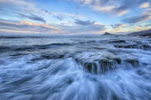 The Surf Of The Atlantic Ocean Crash Over Rocks; West Fjords, Iceland The Surf Of The Atlantic Ocean Crash Over Rocks; West Fjords, Iceland