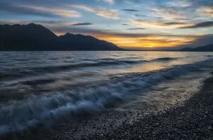 Surf Along The Shore Of Kluane Lake At Sunset; Yukon, Canada Surf Along The Shore Of Kluane Lake At Sunset; Yukon, Canada