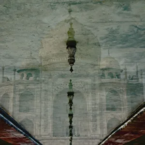 Upside-Down Reflection Of Taj Mahal In A Pool Of Water; Agra, Uttar Pradesh, India Upside-Down Reflection Of Taj Mahal In A Pool Of Water; Agra, Uttar Pradesh, India