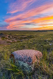 Vast landscape stretching to the horizon at sunset in Grasslands National Park; Val Marie, Saskatchewan, Canada Vast landscape stretching to the horizon at sunset in Grasslands National Park; Val Marie, Saskatchewan, Canada