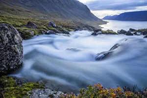 The Water From The Large Waterfall Called Dynjandi Flows By In This Long Exposure On Its Way To The Ocean; Westfjords The Water From The Large Waterfall Called Dynjandi Flows By In This Long Exposure On Its Way To The Ocean; Westfjords