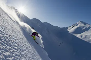 Woman Skiing In The Backcountry Of The Chugach Mountains In Late Winter Woman Skiing In The Backcountry Of The Chugach Mountains In Late Winter